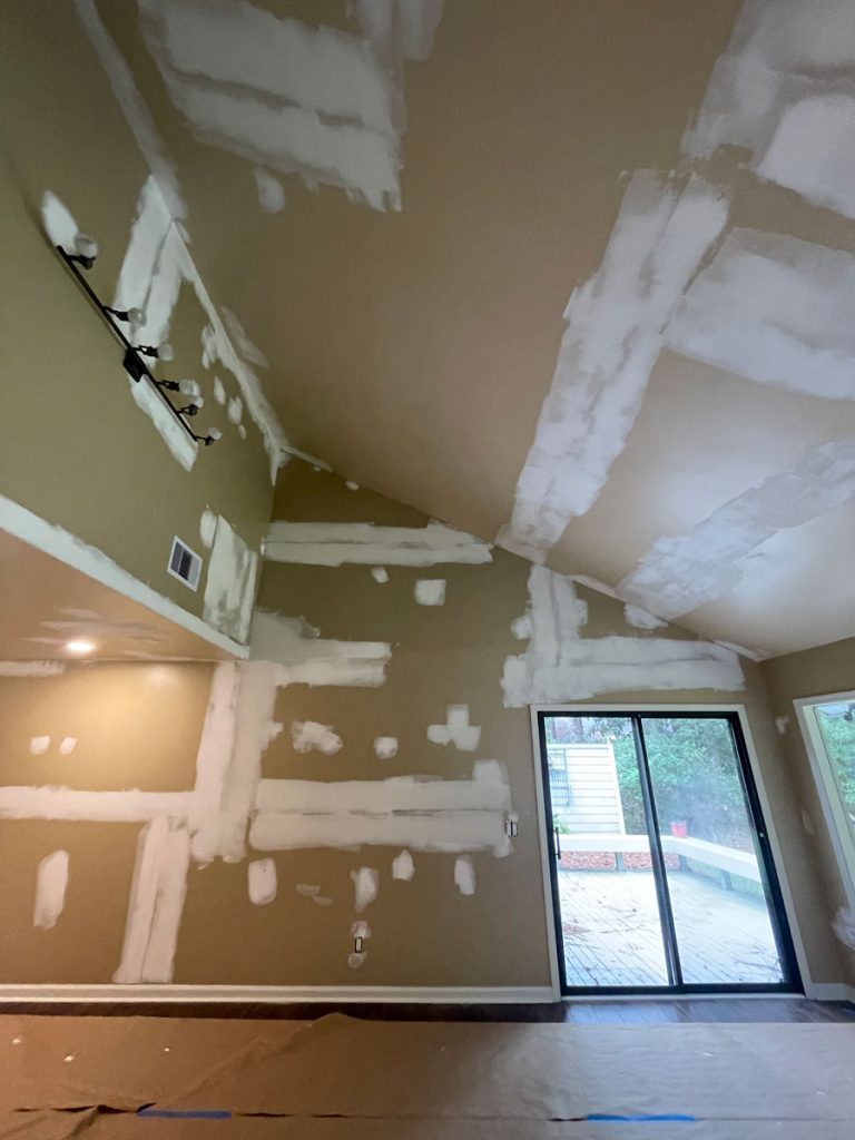 Professional drywall repair and joint compound prep on a vaulted ceiling by Simons Painting & Drywall