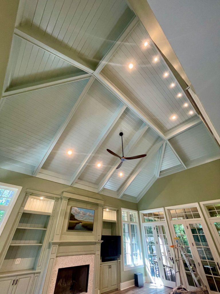 Elegant multi-story home entryway and staircase featuring freshly painted sage green and off-white walls by Simons Painting & Drywall in CT.