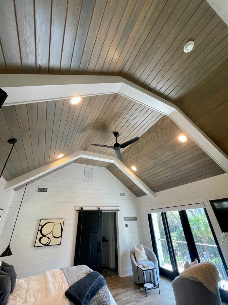 Vaulted wood ceiling with a custom grey stain and clearcoat finish in a Connecticut living space